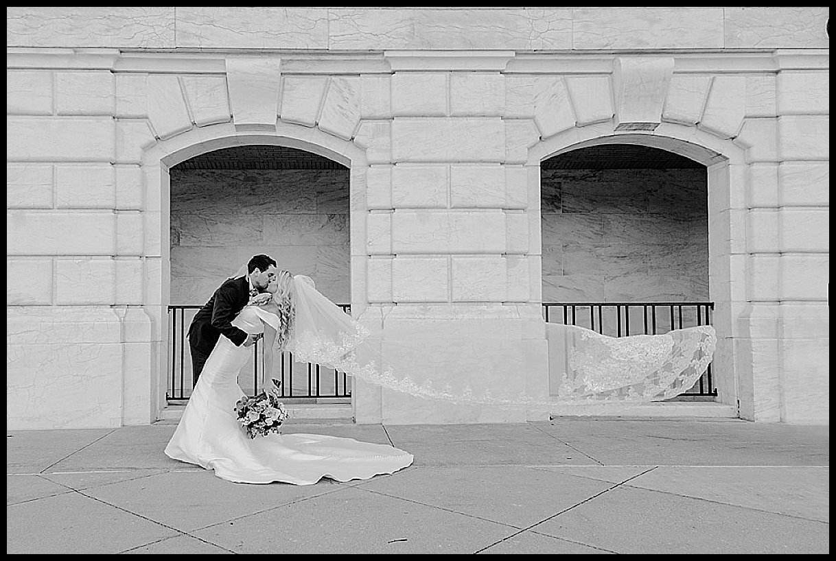 Detroit Institute of Art Downtown Detroit Wedding. Bride and Groom photo with a long veil.
