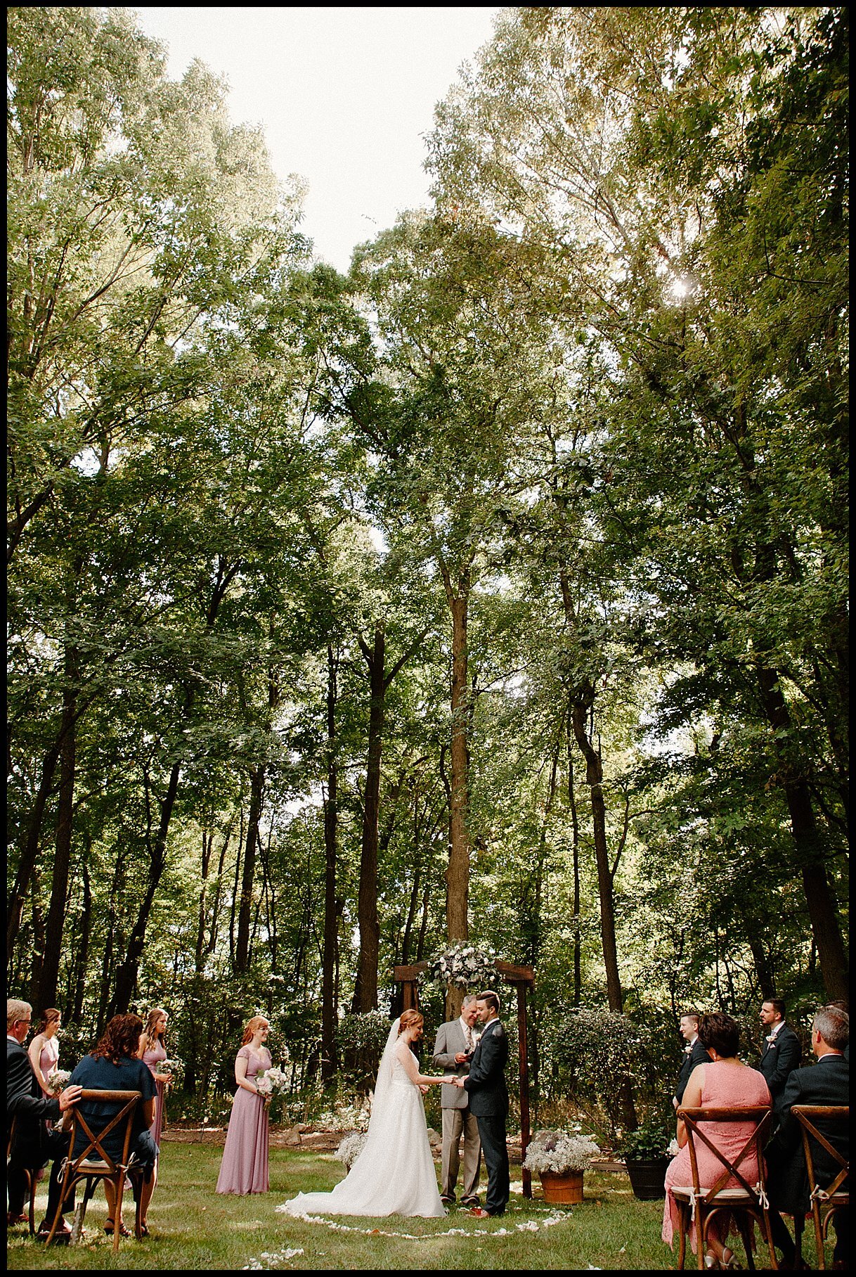 An intimate backyard wedding in the woods in Farmington, Michigan with beautiful sunshine.
