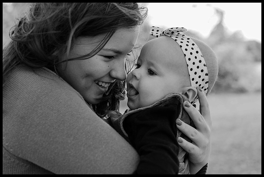 Black and white family photos on belle isle of big sister and little sister. 