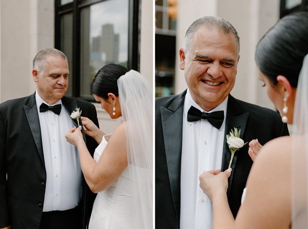 bride helping put a flower on her father's suit jacket 