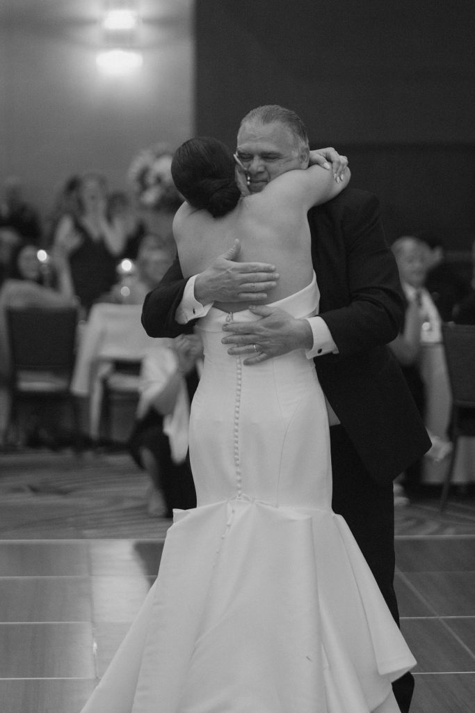 bride and her father hugging 