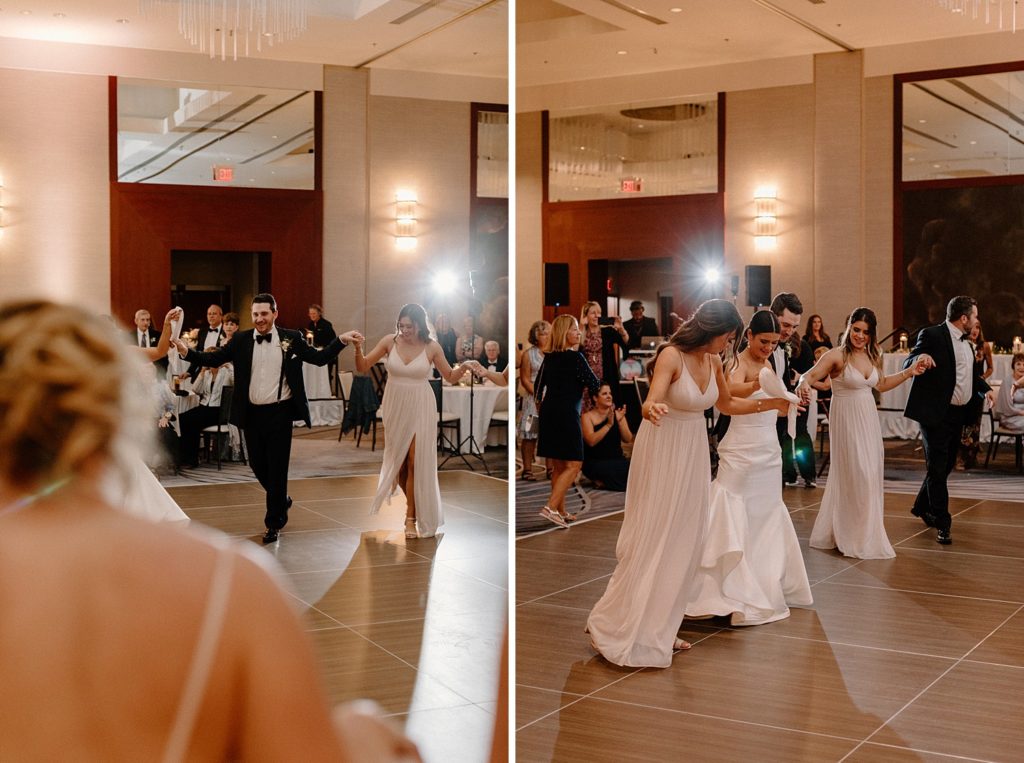 wedding couple and guests dancing together 