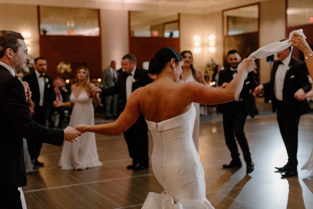 bride dancing with her wedding guests 