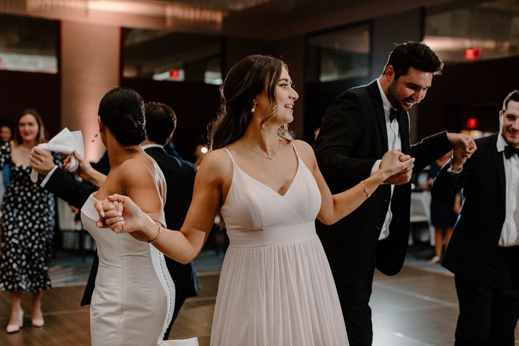 bride dancing with her wedding party 